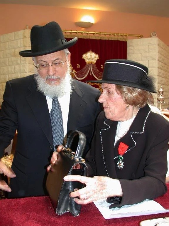 Edith Davidovici wearing her Légion d'honneur medal with Grand Rabbi Joseph Sitruk of France